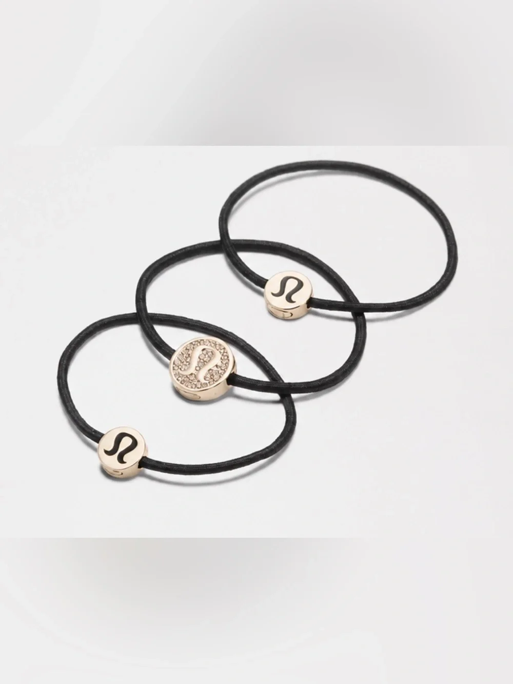 lululemon athletica Black Elastic Bracelets with Gold Logo Charms - Set of 3